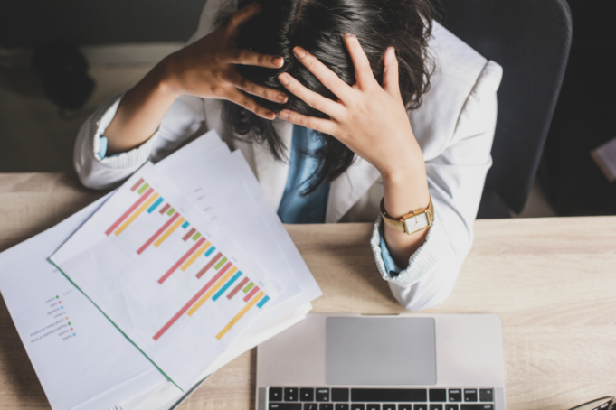 Caught in an Influencer Marketing Crisis? Here’s What to Do A stressed marketer during an influencer marketing crisis.