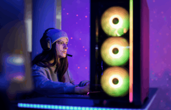 Fictional Branding 411: What Fake Ads Can Teach Real Marketers A person at their gaming PC wearing a headset.