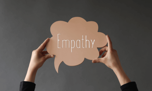 A pair of hands holding up a speech bubble with the word "Empathy" inside. Empathy combined with a sense of humor is a strategy that's making waves, if Cannes Lions is any indication.
