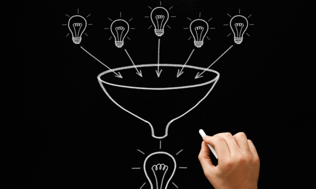 A chalkboard drawing depicts lightbulbs entering a funnel, representing the sales funnel.