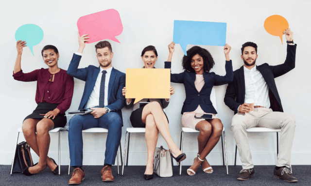 Diverse group of employees holding speech bubbles, representing employee advocacy and employees sharing company and industry content on social media.