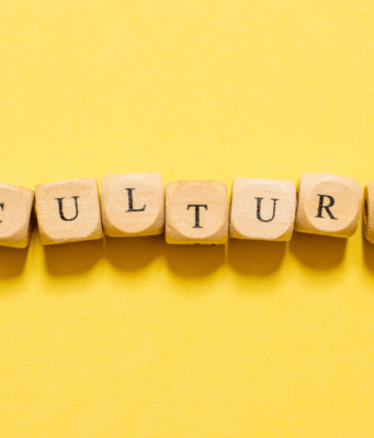 The Cultural Power of Branding: How Brands Influence Norms, Values, and Trust Letter blocks spelling out the word "culture" sit against a yellow background, emphasizing the cultural power of brands as the central theme of the piece.