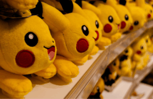 30 Years of Pokémon: Branding Lessons From a Pop Culture Phenomenon Multiple Pikachu plush toys displayed on store shelves, showcasing Pokémon’s global merchandising and brand longevity.
