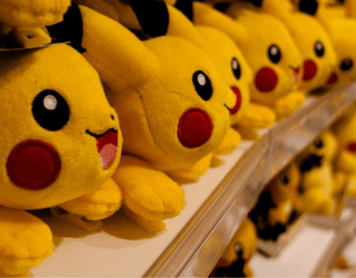 30 Years of Pokémon: Branding Lessons From a Pop Culture Phenomenon Multiple Pikachu plush toys displayed on store shelves, showcasing Pokémon’s global merchandising and brand longevity.